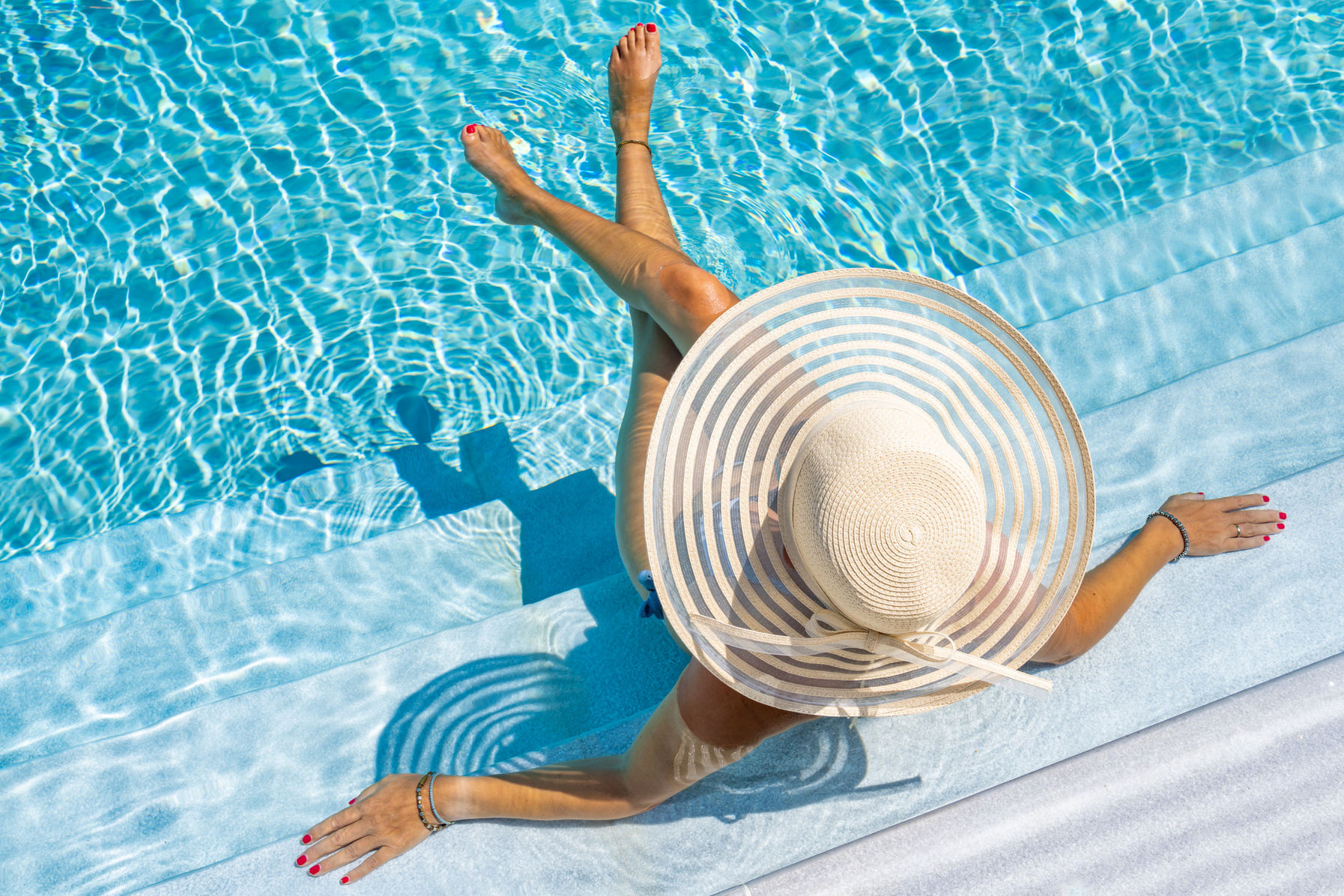 Woman in Luxury Spa Resort Pool